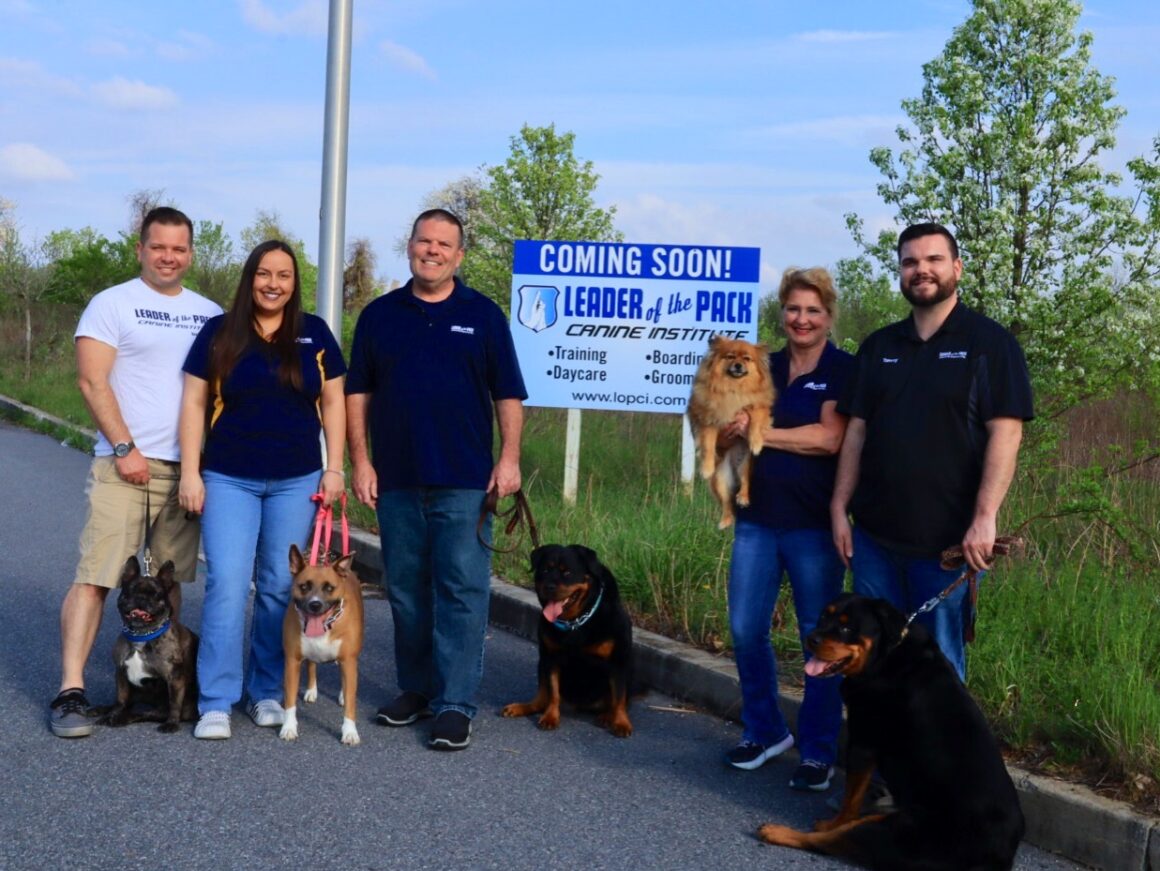 new location sign photo with family